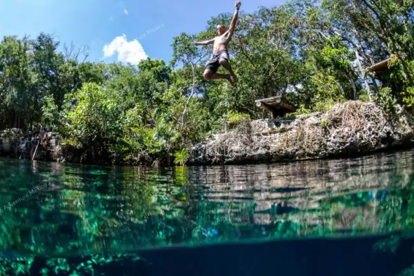 Jumping into jungle  cenote
