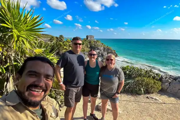 Tourists selfie  with guide at Tulum ruins