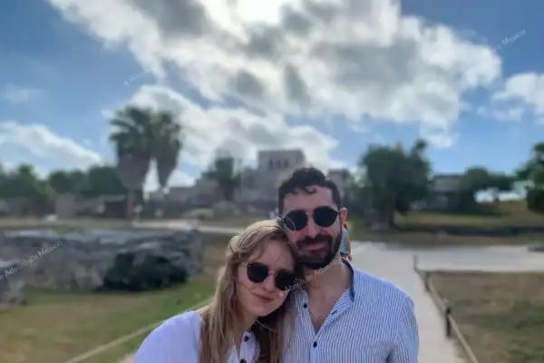 Couple with Tulum  ruins background on private tour