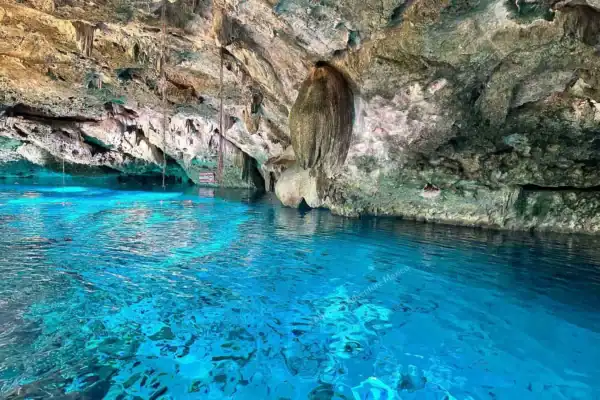 Sunlit water  reflections in Dos Ojos cave
