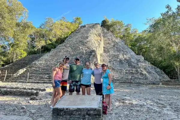 Family pausing in  front of Nohoch Mul pyramid