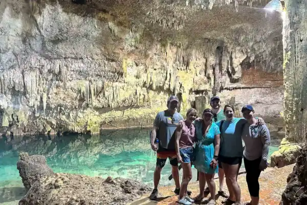 Group of friends  posing inside Cenote Choo Ha