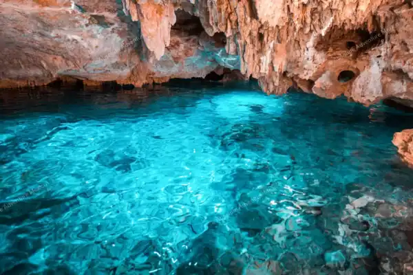 Cave cenote with turquoise water on Tulum snorkeling tour