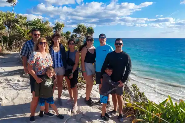 Happy group  visiting Tulum ruins