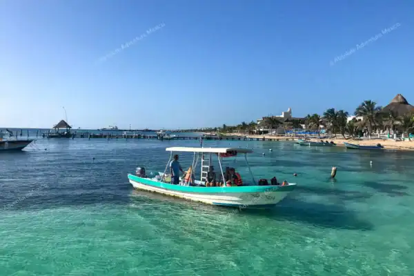 Snorkeling boat  leaving the pier Puerto Morelos
