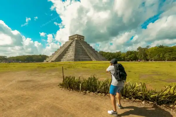 Tourist taking pictures early morning on Chichen Itza private tour