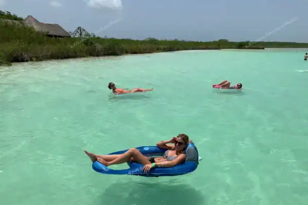 Guest relaxing in  floating boat at Kaan Luum