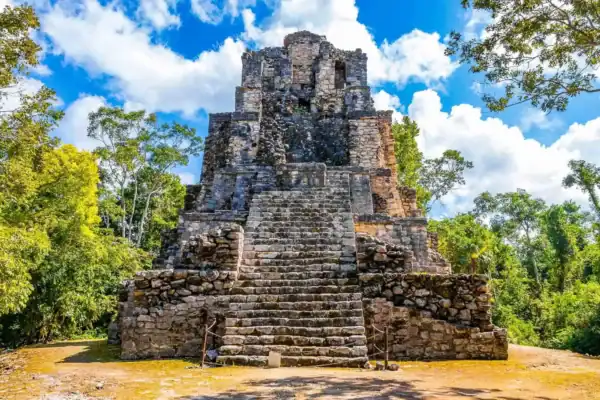 El Castillo pyramid  framed by jungle at Muyil Mayan ruins