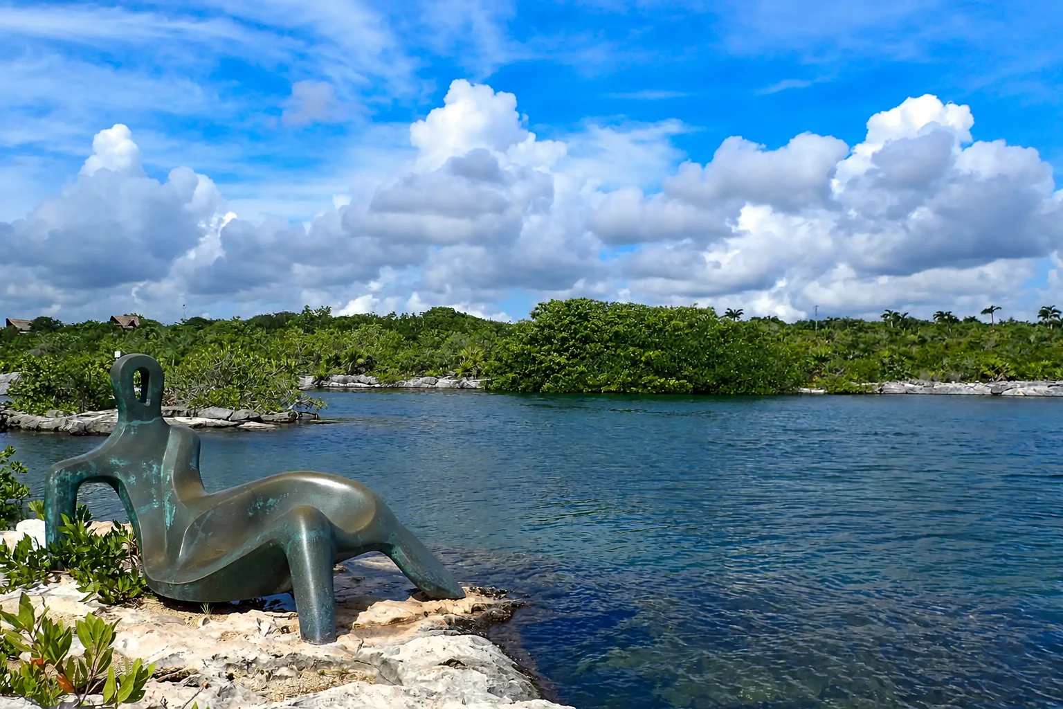 Yal Ku Lagoon beside its rocky shoreline and sculpture