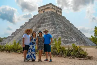 Visitors in front
  of Kukulkan pyramid