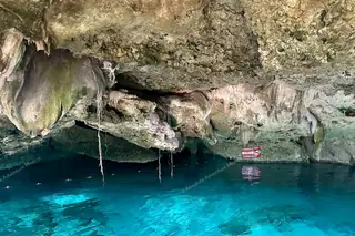 Close-up of
  turquoise water at Dos Ojos