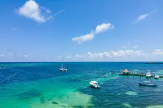 Aerial view of
  Puerto Morelos pier and boats