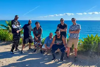 Private group of
  friends with ocean backdrop at Tulum ruins