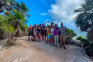 Private group with
  guide at Tulum ruins
