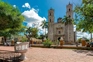 Valladolid main
  park with colonial church view