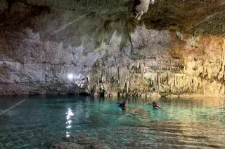 Cenote Choo Ha with
  swimmers