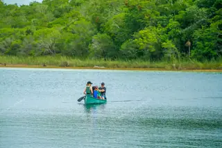 Family crossing
  Punta Laguna in canoe