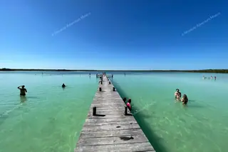 Wooden pier into
  Kaan Luum Lagoon