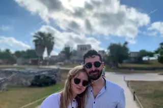 Couple with Tulum
  ruins background on private tour