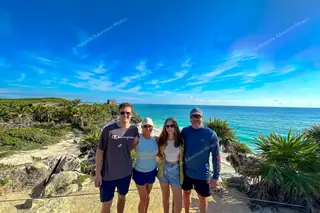 Happy group at
  iconic picture spot Tulum ruins