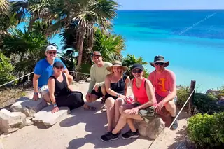 Friends by cliff
  enjoying view on Tulum ruins cenote turtles tour