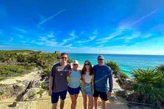 Happy group
  visiting Tulum ruins on Tulum boat tour