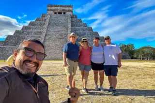 Guide selfie with
  group of four on Chichen Itza private tour