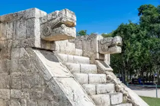 Snake head carving
  close-up at Chichen Itza