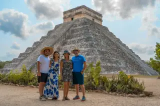 Visitors in front
  of Kukulkan pyramid