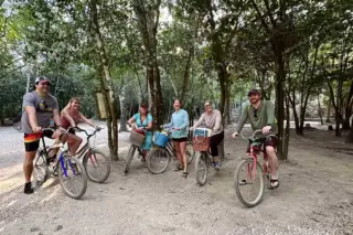 Biking through
  jungle paths at Coba private tour