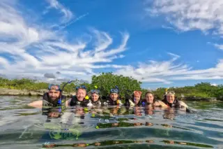Happy group of
  snorkelers at Yal Ku lagoon