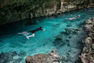 Snorkeling in
  cenote near Tulum