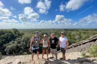 Friends on top of
  Ek Balam pyramid during private tour