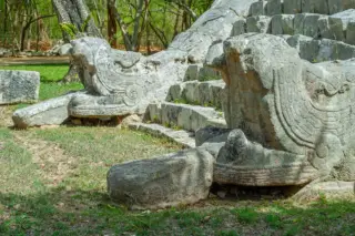 Close-up of serpent
  sculptures Chichen Itza